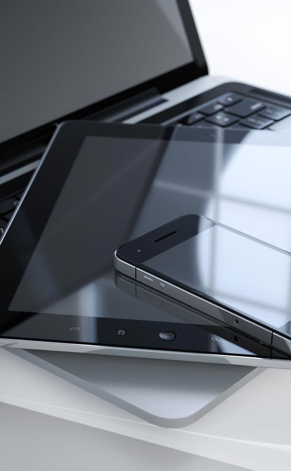 photo of mobile phone tablet and laptop